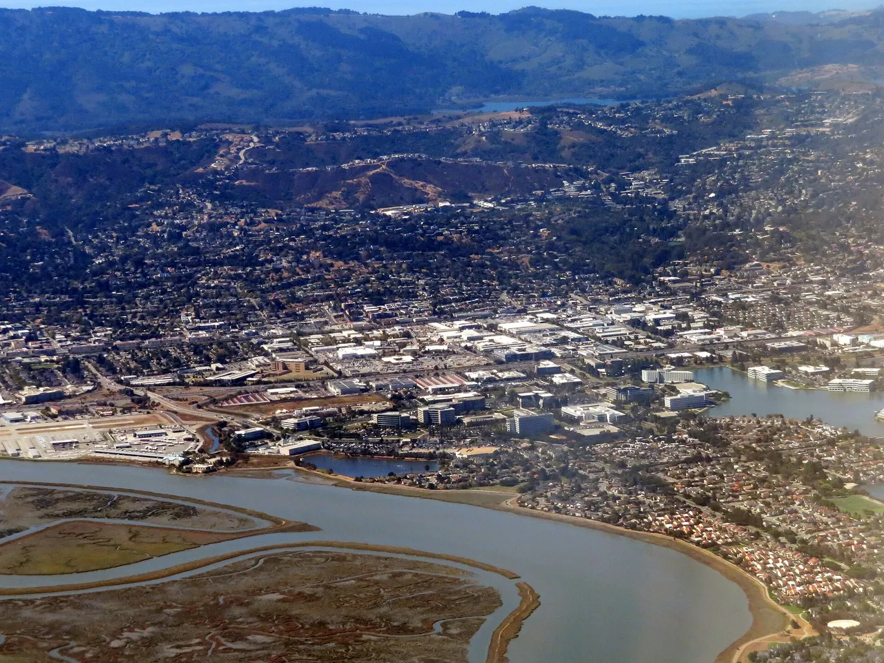 Aerial view over Belmont, with neighborhoods and hills beyond the bayshore.