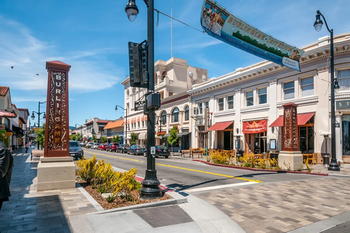Storefronts, street lamps and a pedestrian crossing on Burlingame Avenue.