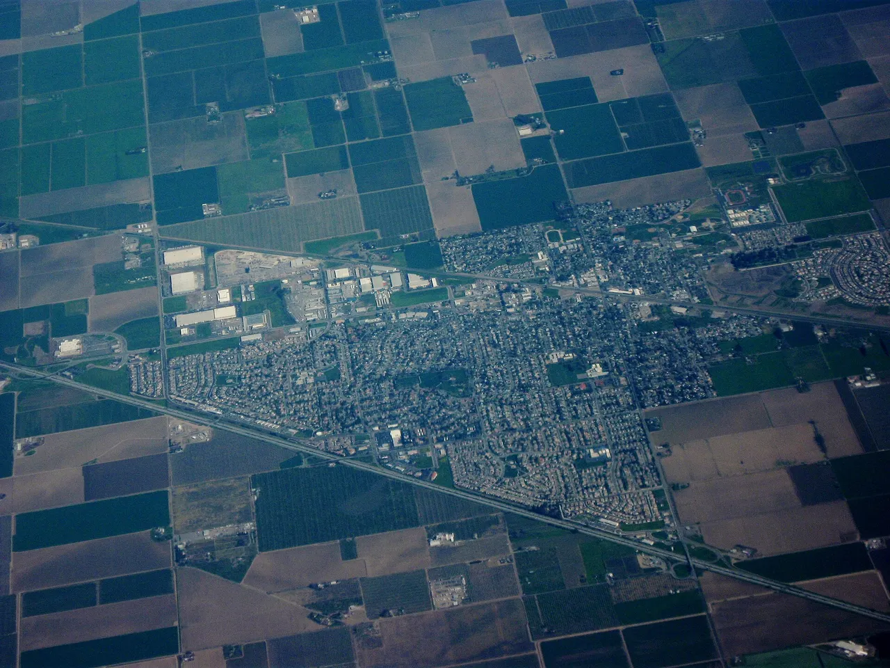An aerial view of Dixon streets surrounded by agricultural fields.