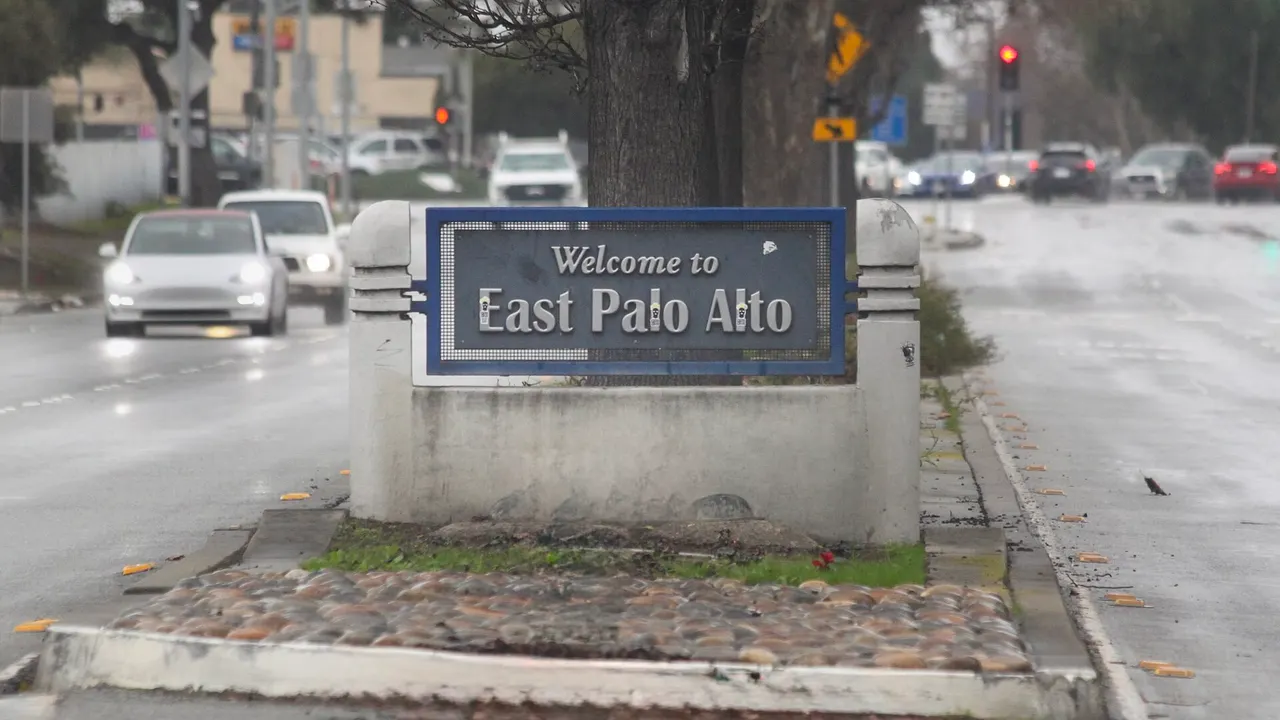 A welcome sign on a landscaped median in East Palo Alto.