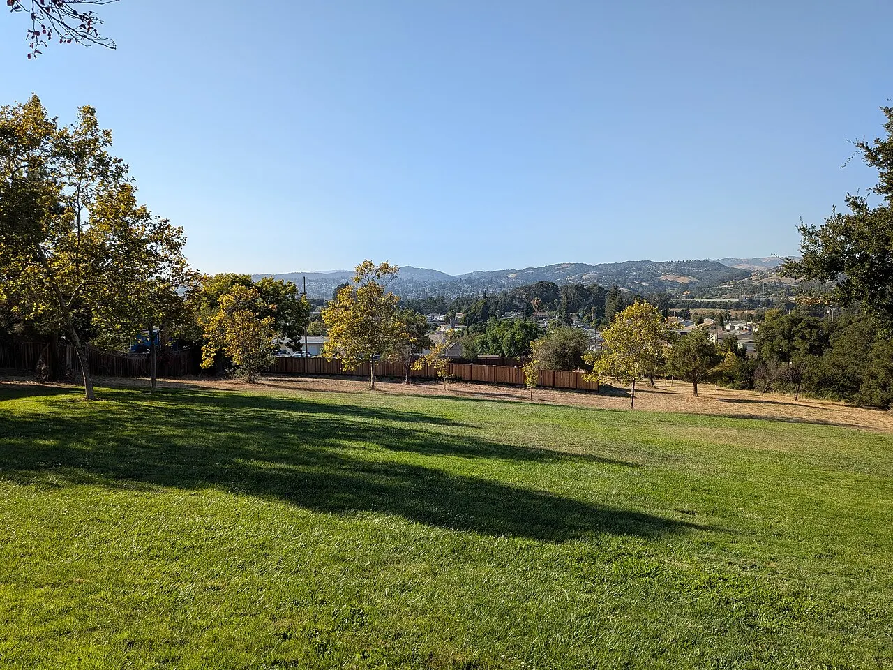 Grass, trees and distant hills at Lakeridge Park in the unincorporated community of Fairview.