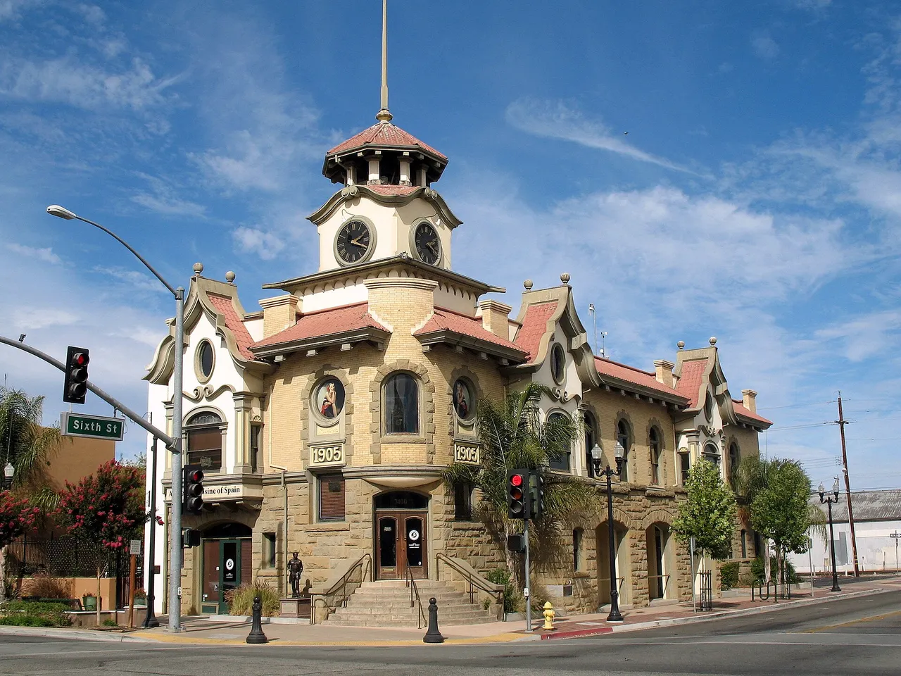 The historic Gilroy City Hall building at a downtown street corner.