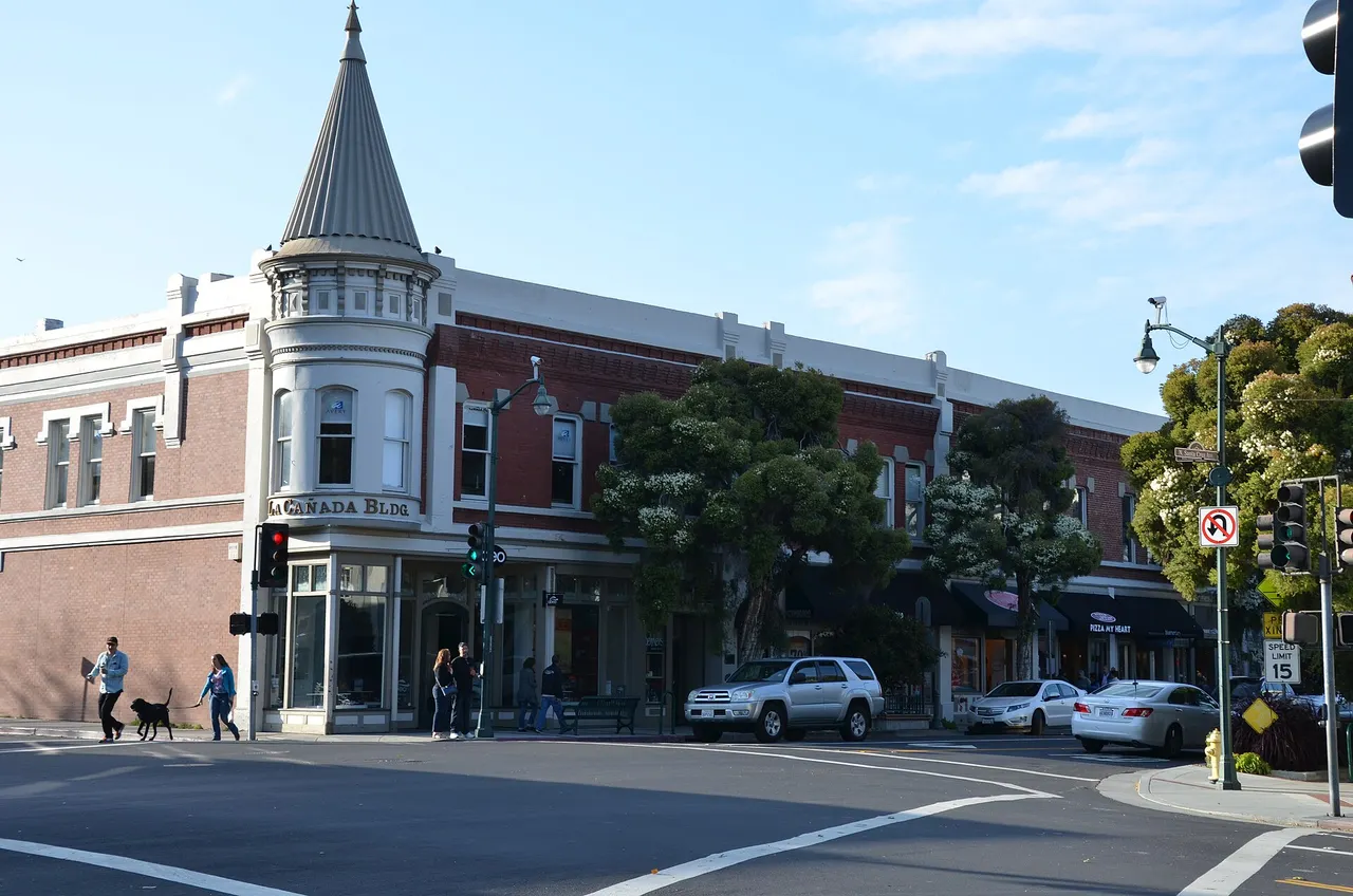 The turreted La Cañada Building at a downtown Los Gatos street corner.