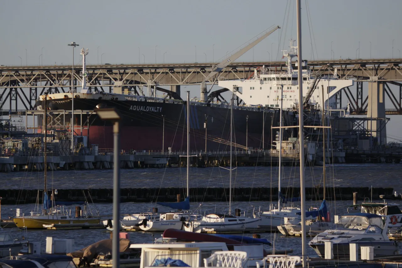 Boats at Martinez Marina with a tanker and the Benicia-Martinez Bridge beyond.