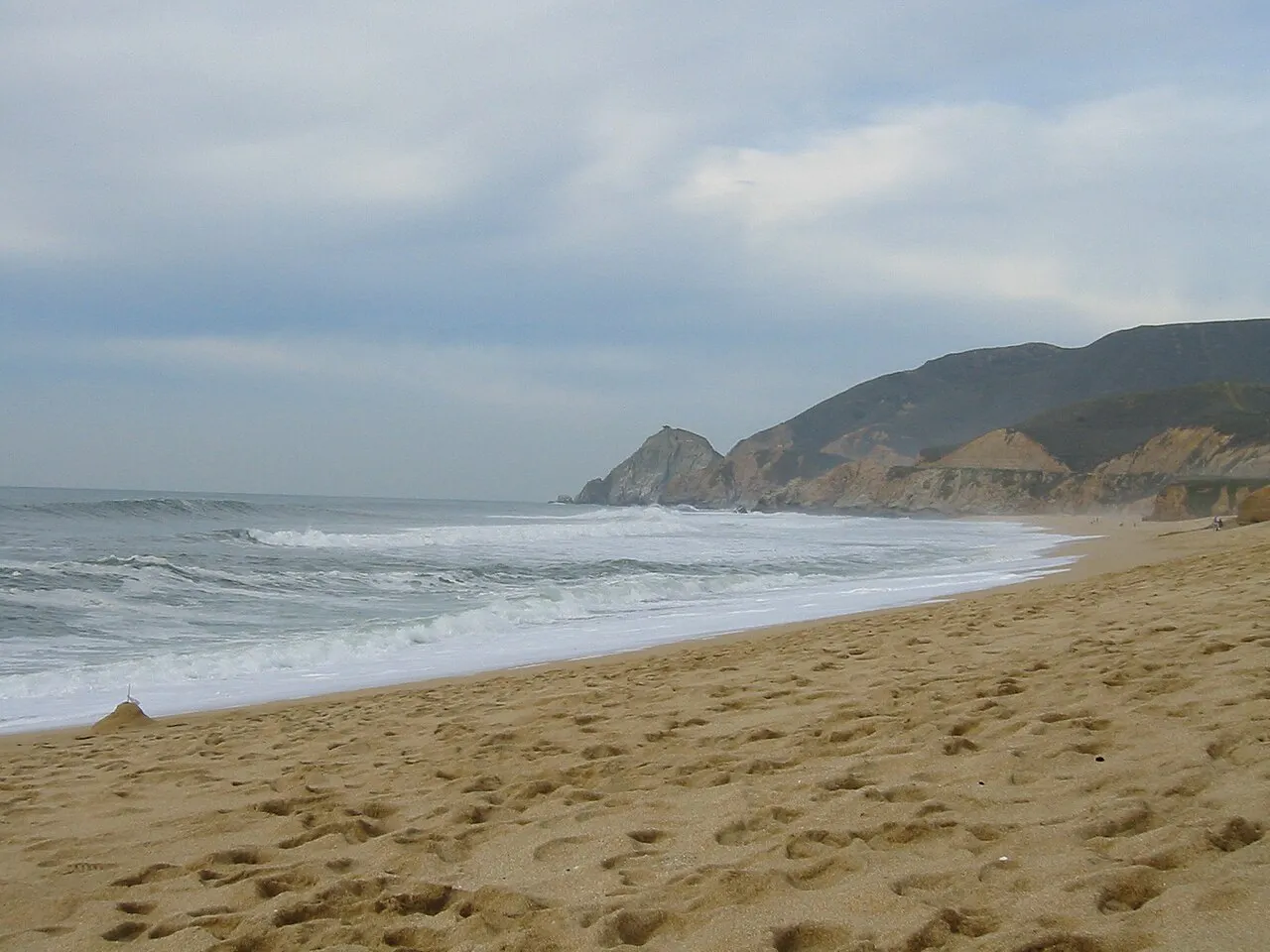 Waves and clouds along Montara State Beach.