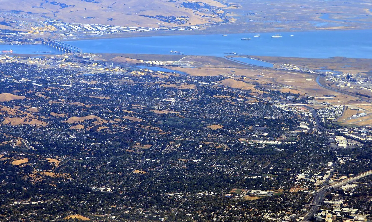 An aerial view of Pacheco and Martinez neighborhoods with the Carquinez Strait beyond.