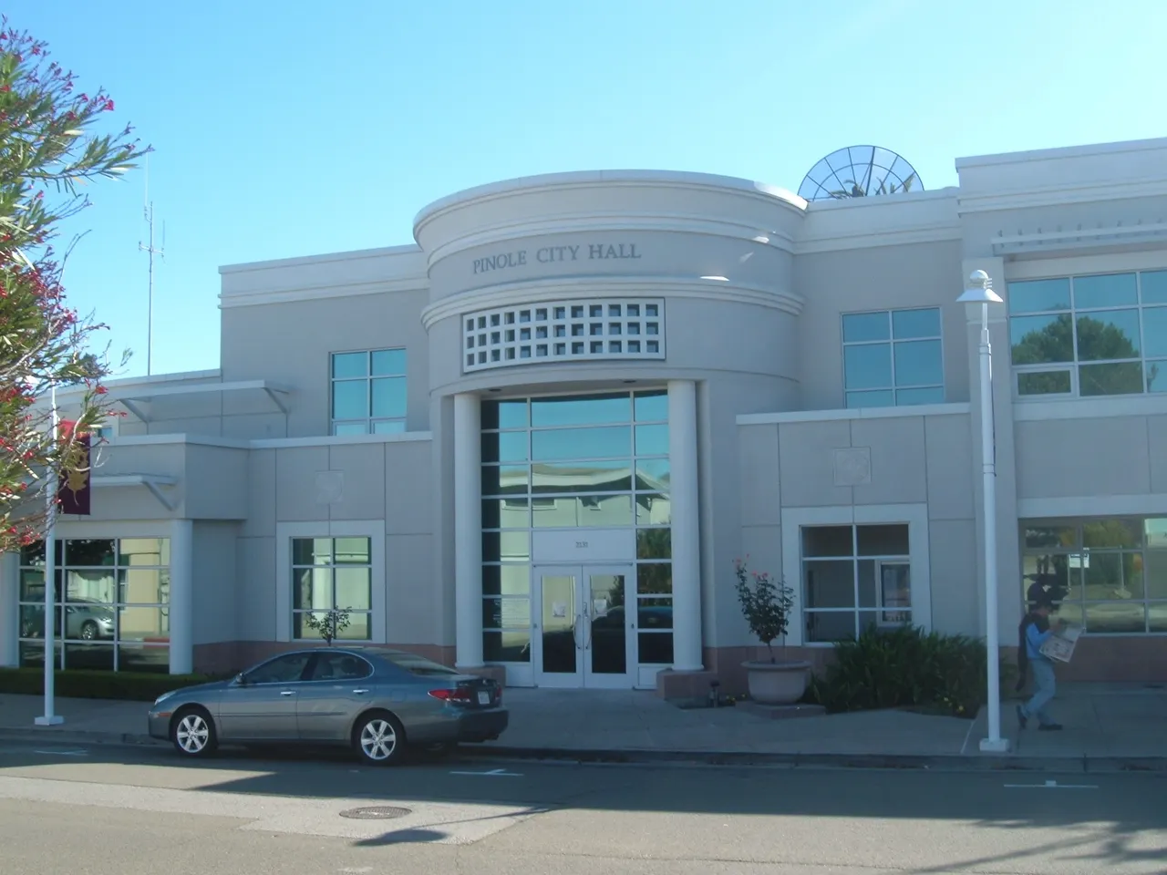 The curved entrance and pale facade of Pinole City Hall.