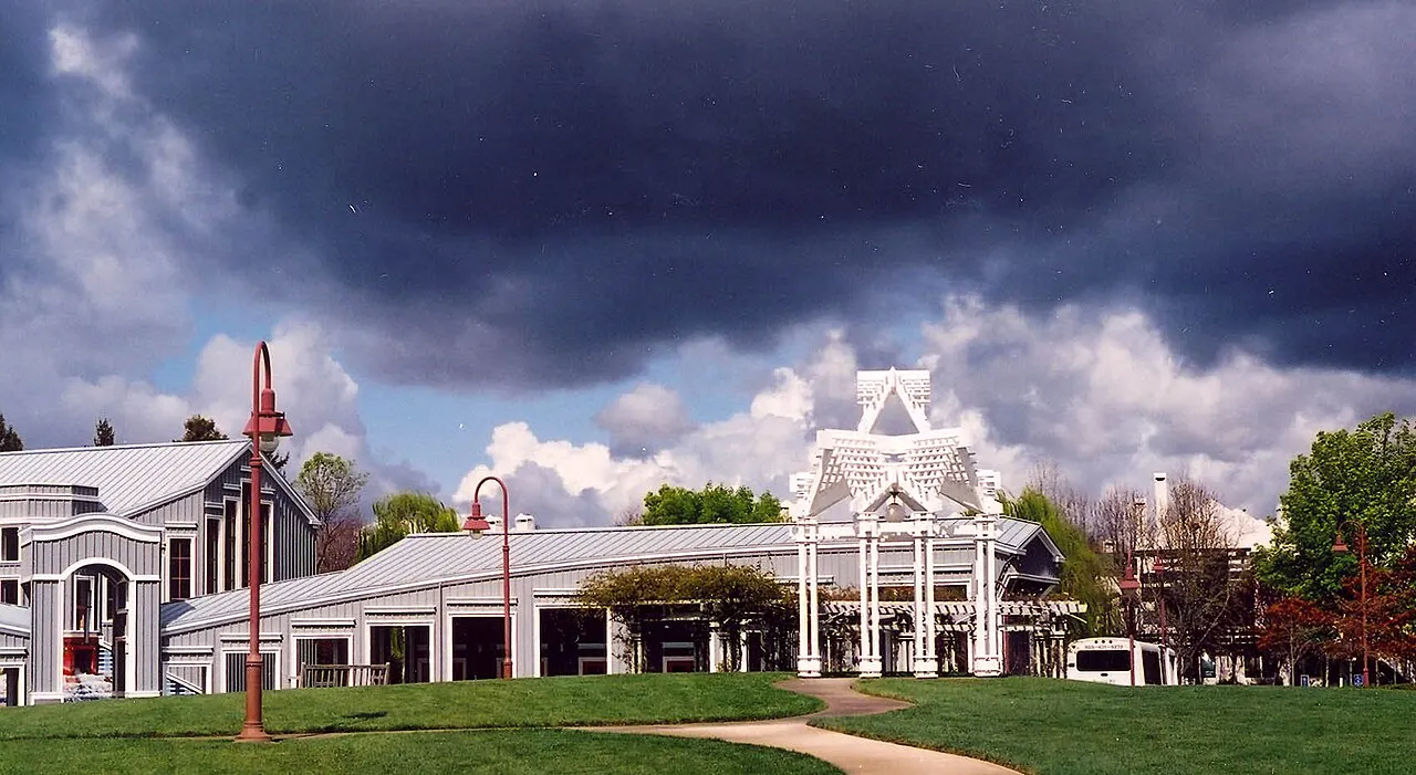 Pleasant Hill City Hall and its fountain beneath dark clouds in March 2003.