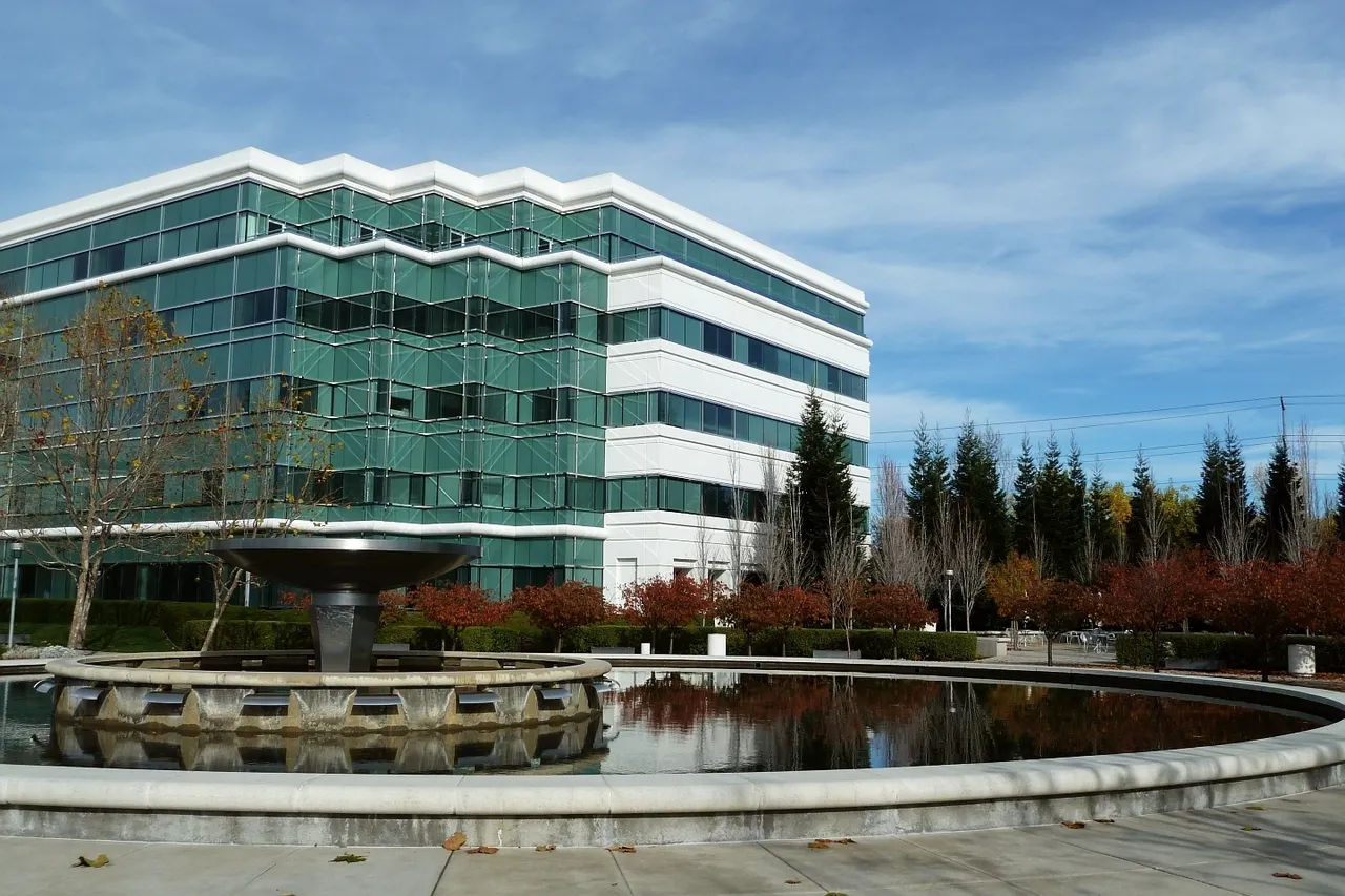A glass office building and reflecting pool at Bishop Ranch in San Ramon.