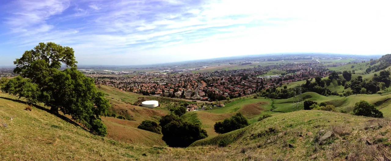 Green hills above Vacaville, looking toward neighborhoods and the valley.