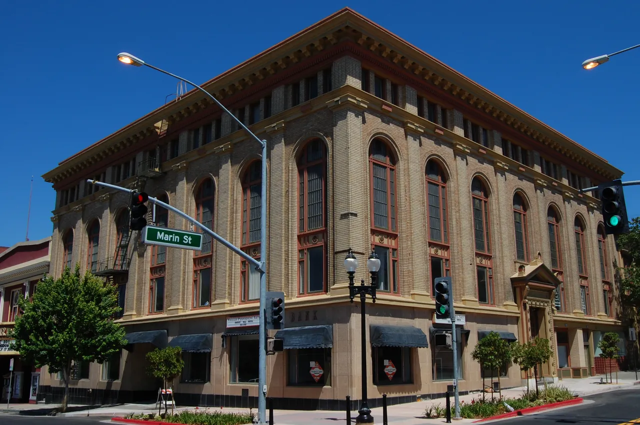 Vallejo Masonic Temple at a downtown street corner, with tall arched windows and a blue sky.